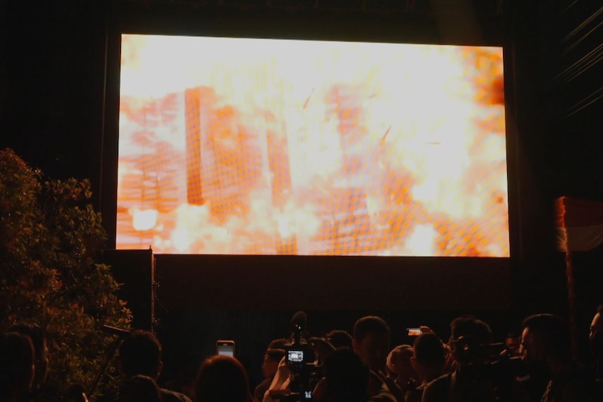 A video screen showing an explosion 