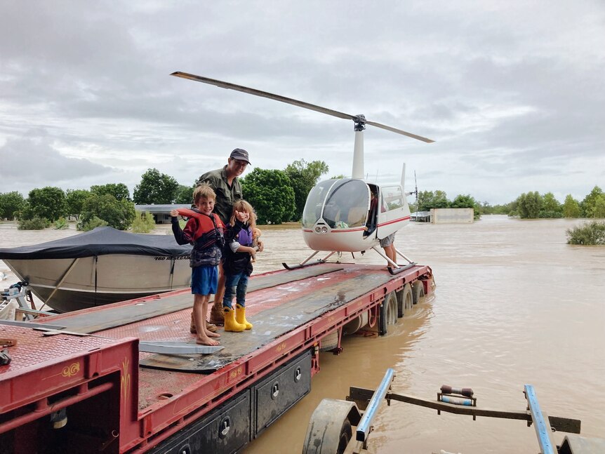 a family stands on a pontoon