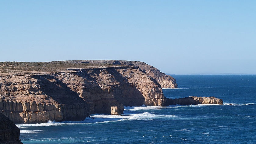 Cliffs over a blue ocean