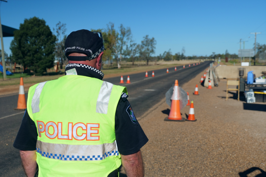 A policeman wearning a hi-vis vest