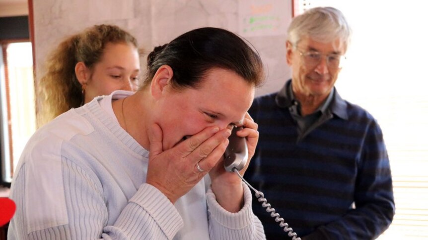 Fedor Konyukhov's wife Irina sheds tears of happiness as she speaks to her husband on the phone.