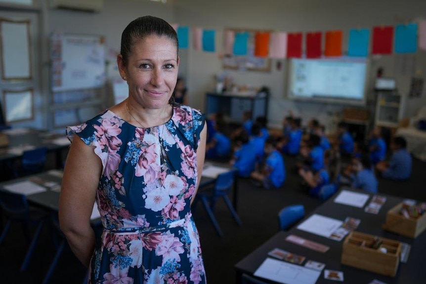 Ashcroft Public School teacher and assistant principal Karen Ali stands smiling, holding her arms behind her back.