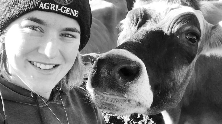 Young dairy farmer Sally Downie pictured with Clementine the cow.