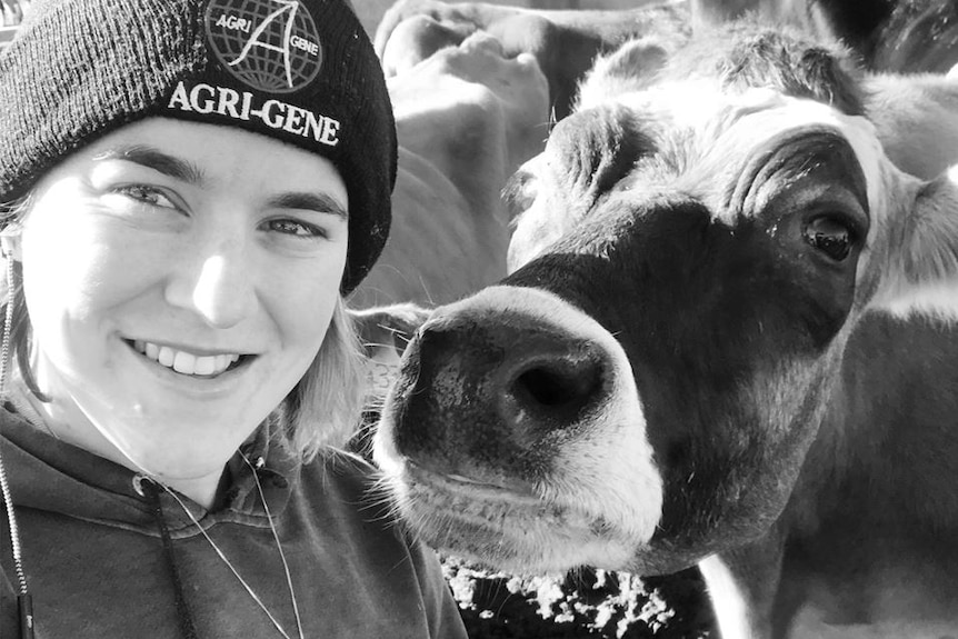 Young dairy farmer Sally Downie pictured with Clementine the cow.