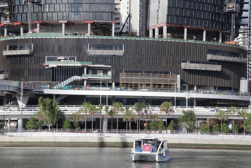 Close up of a ferry in front of the Star casino and Queen's wharf development.