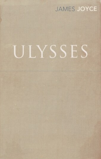 The book cover of Ulysses by James Joyce featuring the book's name and author in white letters on a canvas background