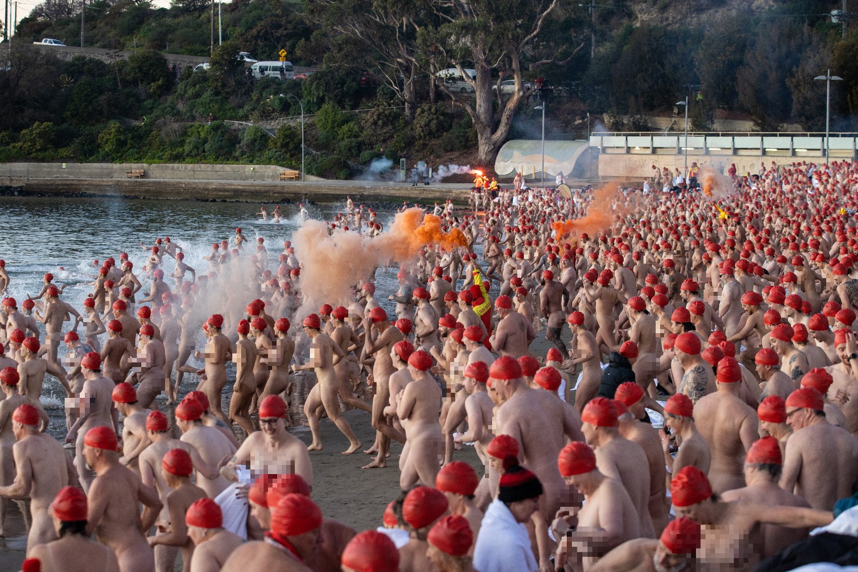 Nude swimmers in Hobart celebrate passing of the longest night and end of Dark Mofo