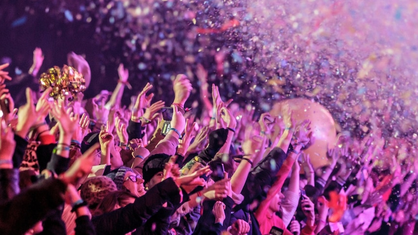 The crowd being showered in confetti at Tame Impala's Friday headlining set at Splendour In The Grass, 19 July 2019