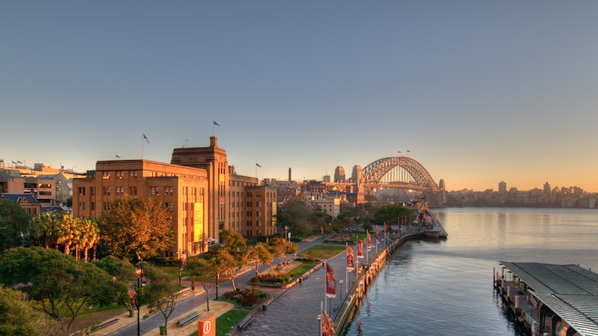 A view of the Museum of Contemporary Art Australia with the Sydney Harbour Bridge visible in the background.