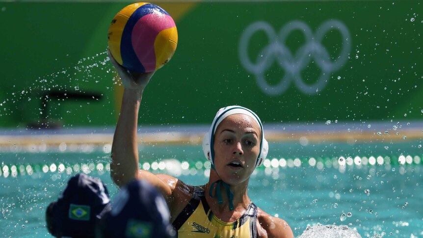 Water polo player Gemma Beadsworth prepares to pass the ball during a game