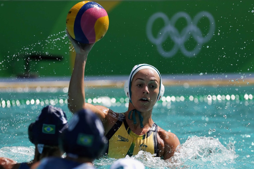 Water polo player Gemma Beadsworth prepares to pass the ball during a game