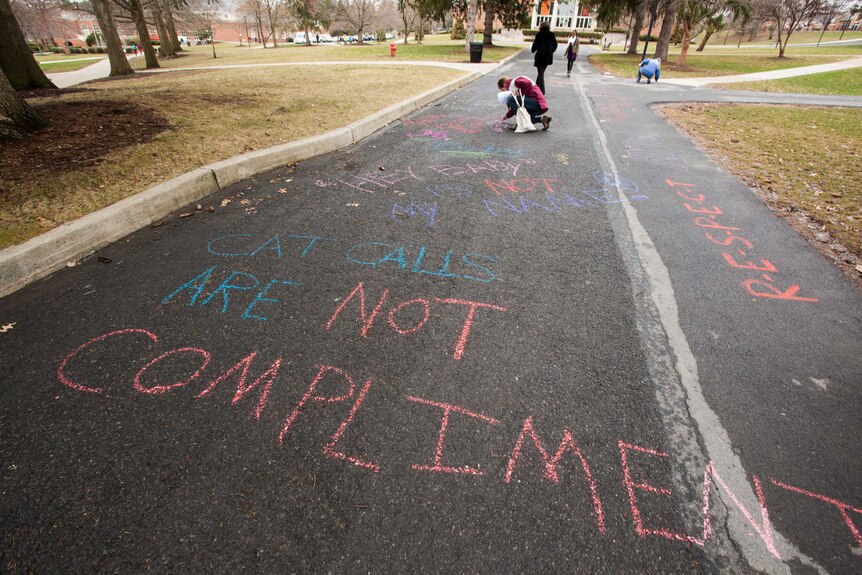 Anti-street harassment messages written in chalk