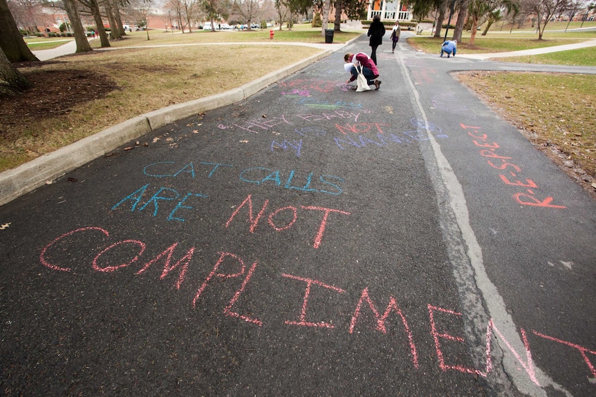 Anti-street harassment messages written in chalk