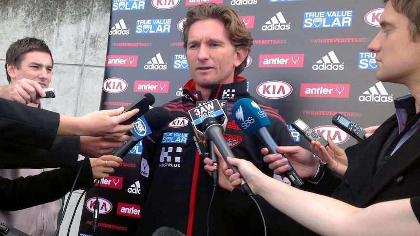 Essendon coach James Hird speaks to the media at training.