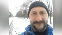 Pavel Kuljuk stands in a deserted snow covered park in eastern Ukraine