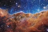 The 'Cosmic Cliffs' of the Carina Nebula, with stars speckled across the image