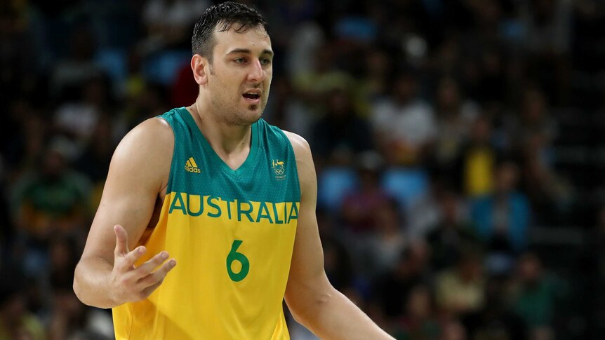 Australia's Andrew Bogut reacts after fouling out from bronze medal basketball match against Spain.