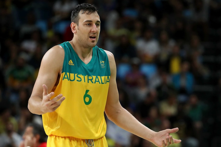 Australia's Andrew Bogut reacts after fouling out from bronze medal basketball match against Spain.