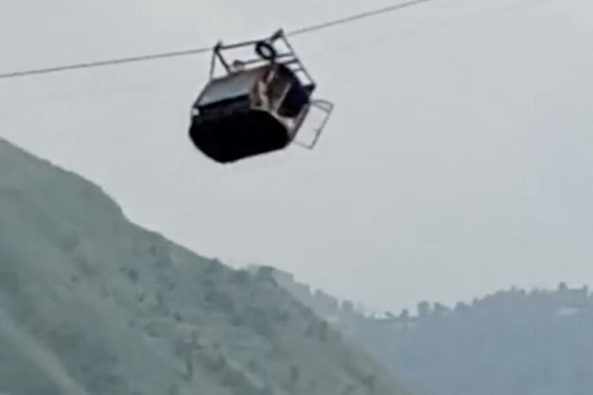A cable car which has come partially off it's cable in Pakistan.