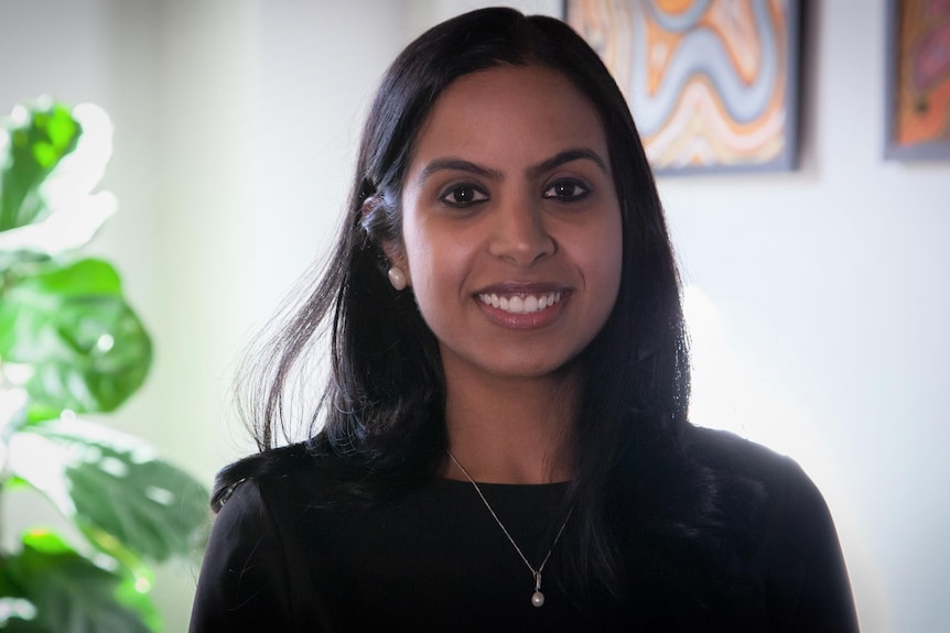 A woman smiling at the camera.