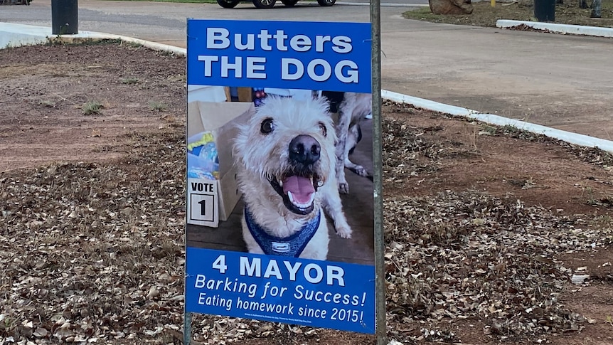 A placard on a verge outside a motel.