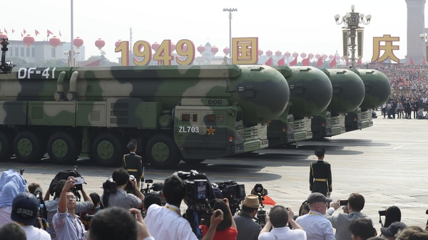 Journalists take photos of the intercontinental ballistic missile, the Dongfeng 41.