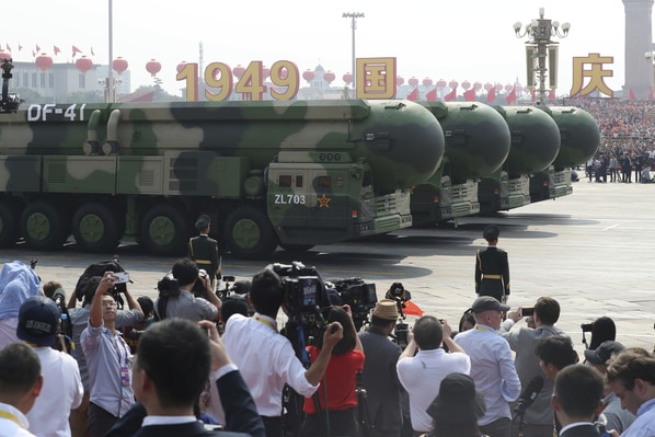 Journalists take photos of the intercontinental ballistic missile, the Dongfeng 41.