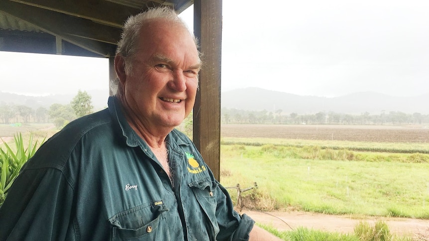 Barry Brooks puts his hand out to feel the rain