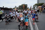 Protesters march through the streets of Redfern to remember the death of 'TJ' Hickey.