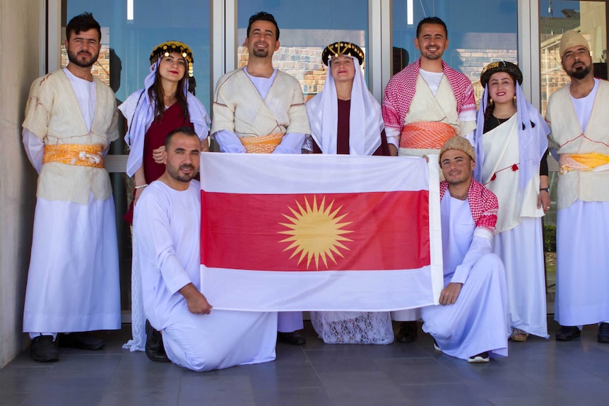The Toowoomba Ezidi dance group pose for a photo at the Regional Settlement Conference.