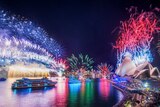 Sydney Harbour Bridge lights up during the New Year's Eve fireworks display.