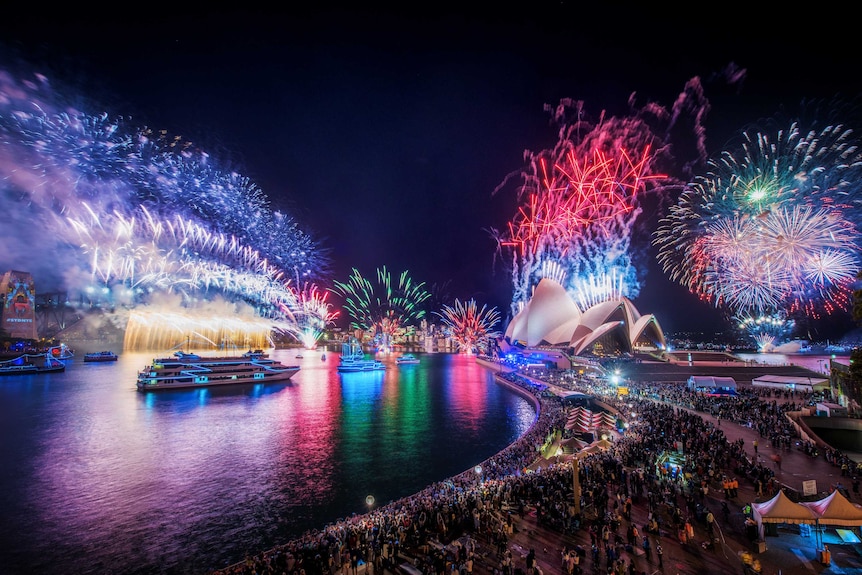 Sydney Harbour Bridge lights up during the New Year's Eve fireworks display.