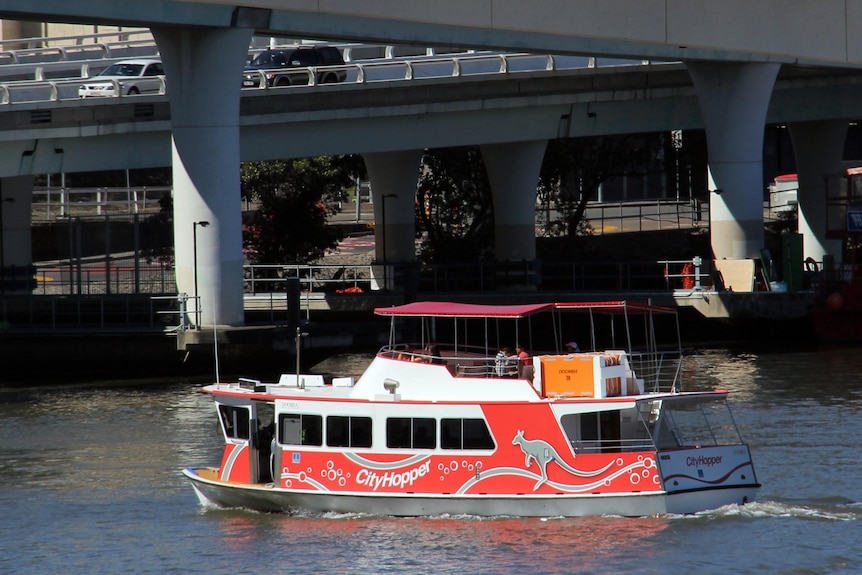 A CityHopper ferry makes its way across the Brisbane River.