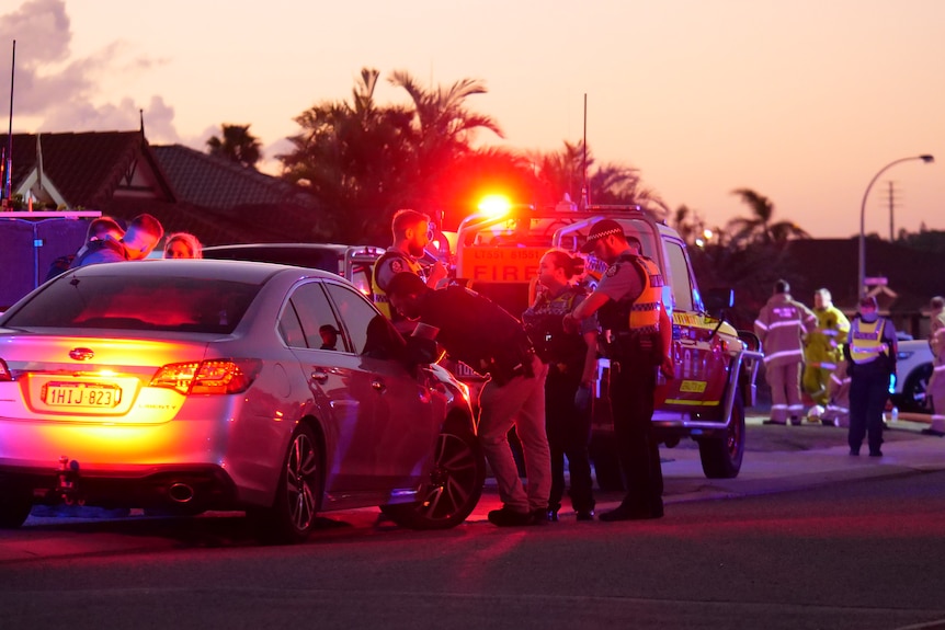 Emergency services responding to an incident in a suburban street