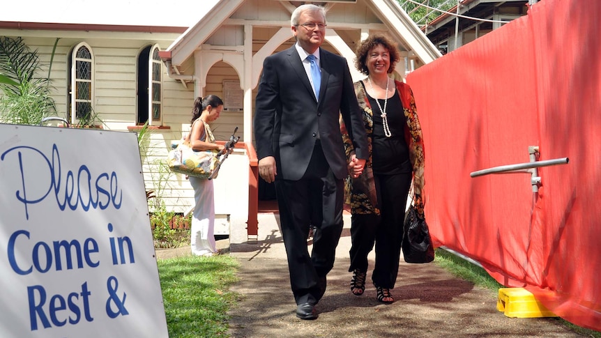Kevin Rudd leaves a Brisbane church service with wife Therese Rein