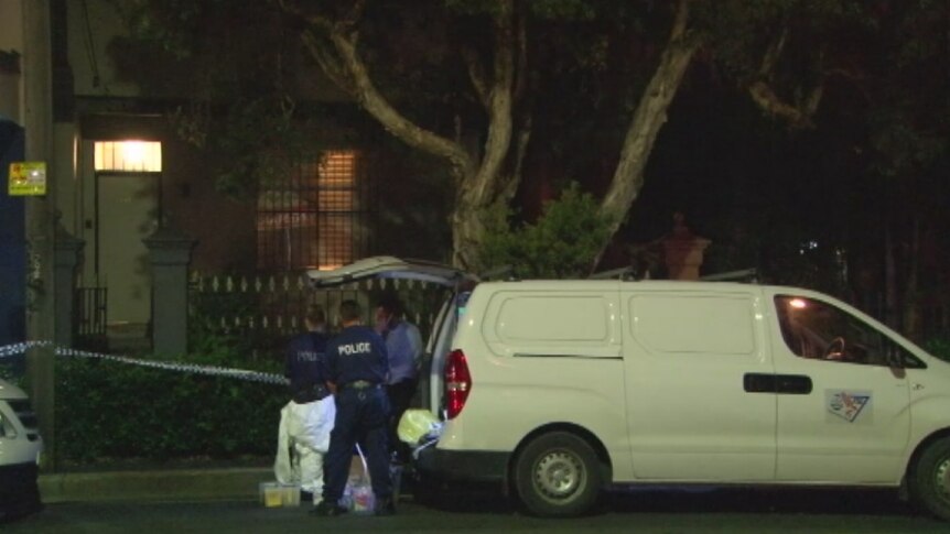 Police forensic investigators outside a property where a woman was stabbed yesterday.