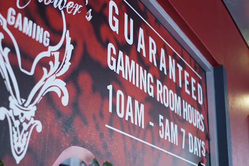 A sign advertising a hotel gaming room hours seven days a week