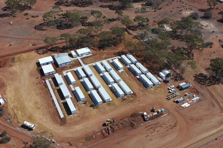 A drone photograph of a mining camp under construction.