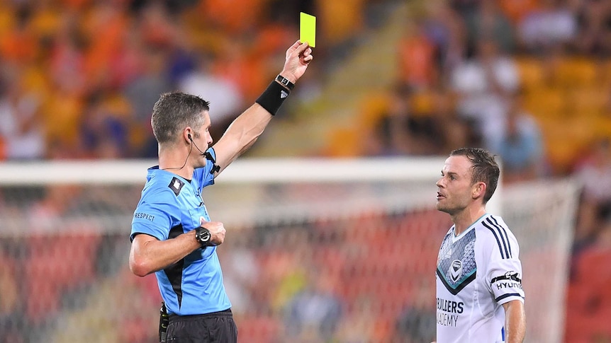 Leigh Broxham gets a yellow card