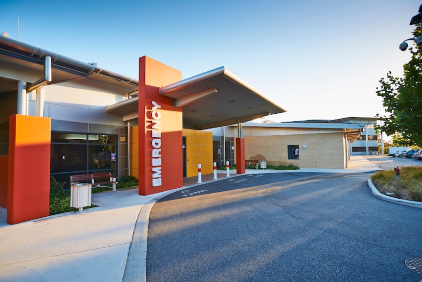 Joondalup Health Campus emergency entrance with red and yellow signage.