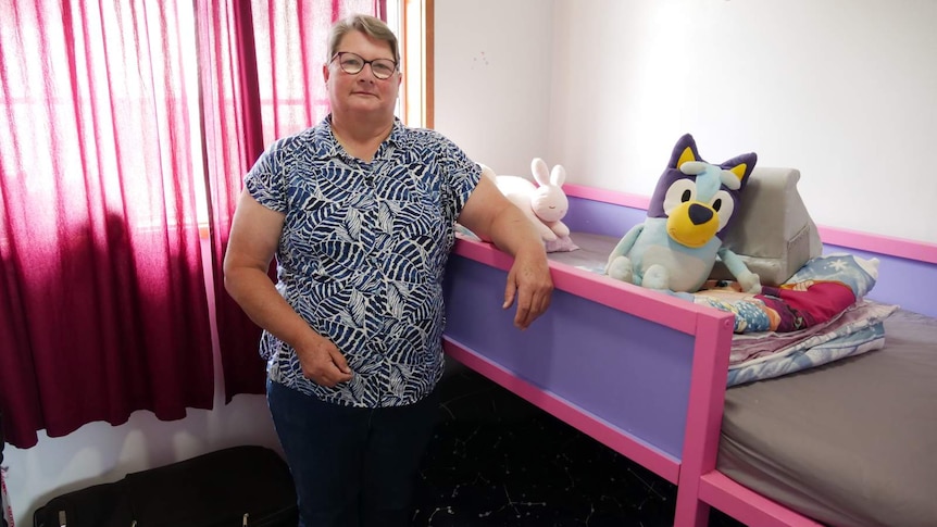 Karen Morris in Cooma stands at her granddaughters bed
