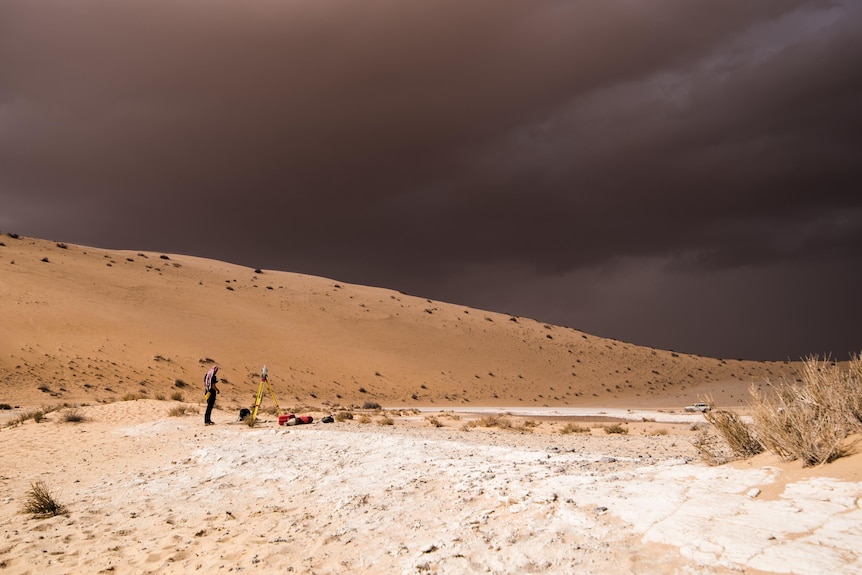 Dark clouds over sand dunes