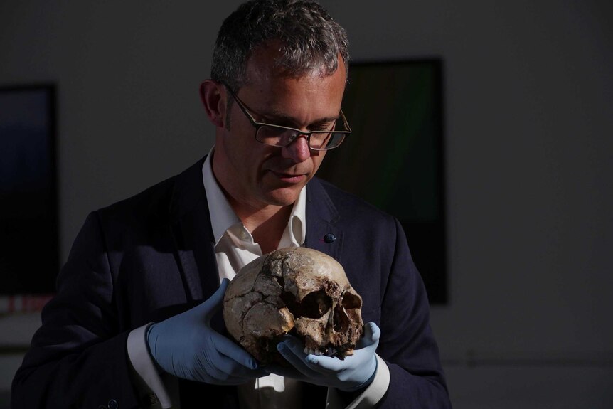 Professor Ian Barnes displays the skull of cheddar man