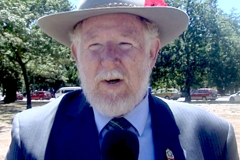 Dr Rob Webster standing outside with a hat on.