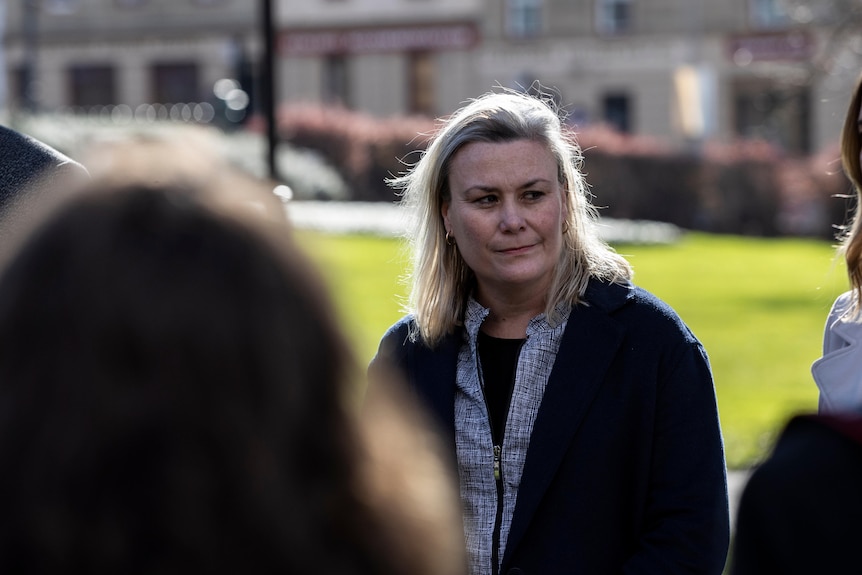 Tasmanian Labor MP Anita Dow looks past leader Rebecca White during a press conference outside Parliament