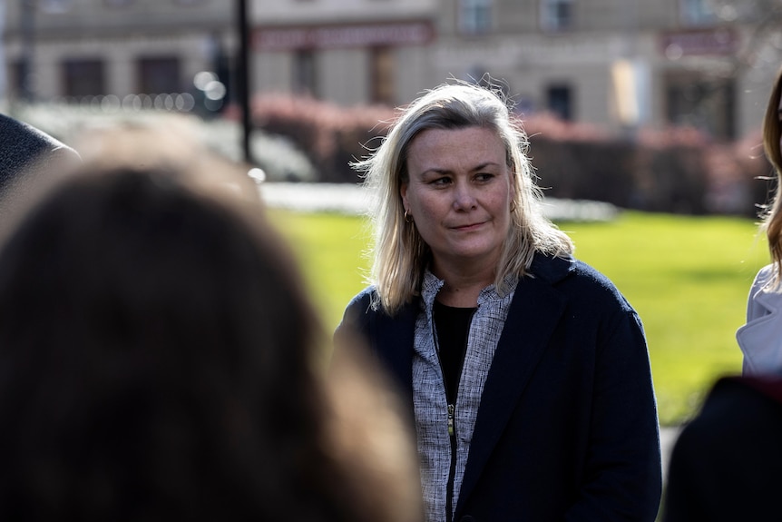 Tasmanian Labor MP Anita Dow looks past leader Rebecca White during a press conference outside parliament