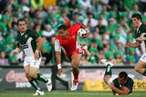 A flying Cooper Vuna is ankle tapped on his way through the Irish defence.