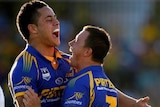 Jarryd Hayne (L) and Tim Smith celebrate a Parramatta try in their drubbing of the Broncos.