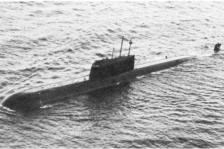 A black-and-white image of a submarine in the water.