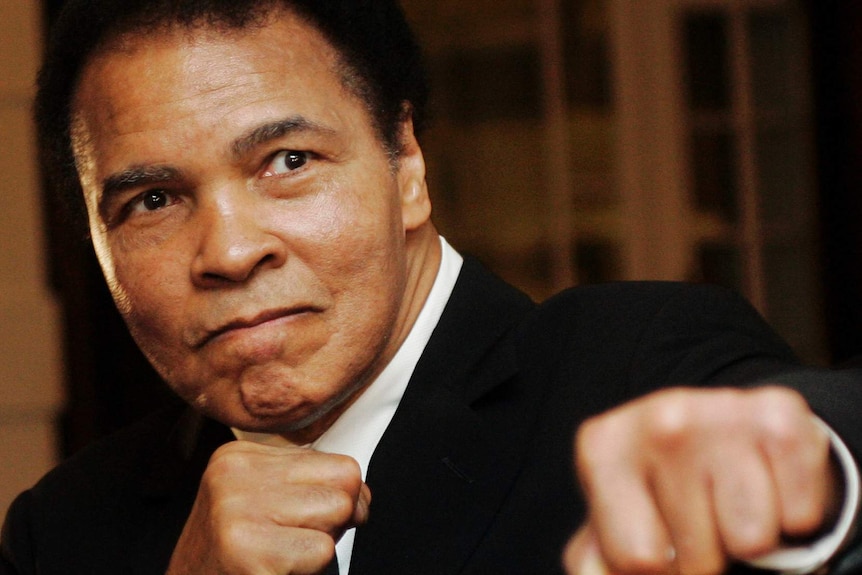 Muhammad Ali poses with a punch.